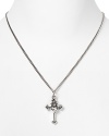 Introduce a Left Coast attitude into your jewelry box with Queen Baby's sterling silver pendant. Slip the traditionally styled silver cross over feminine tops and dresses for a hit of meaningful sparkle.