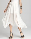 An ethereal, ivory Aqua skirt softens your style, flaunting feminine pleats on an asymmetric silhouette.