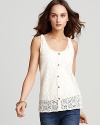 Delicate lace lends romance to this Volcom tank, featuring a button-up front for a polished finish.