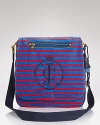 Juicy Couture makes school more stylish, updating the messenger bag with velour stripes, an oversized embroidered logo and large tassels at the ends.