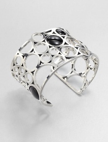 From the Regitze Collection. A striking, sculptural open cuff formed of cutout circles of gleaming sterling silver, dotted with discs of rich black agate.Black agateSterling silverDiameter, about 2¼Width, about 1¾Imported