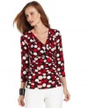 Add a whimsical touch to your wardrobe with Ellen Tracy's polka-dot-print top.