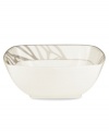 Abstract markings in soft shades of khaki fill in this glazed white serving bowl for unconventional elegance. Trimmed with matte platinum, its sleek, modern shape looks sharp on casual and formal tables alike. From Noritake's collection of serveware and serving dishes.