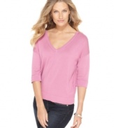 Cable & Gauge gives a basic piece a new look: this V-neck sweater features chic buttons along the back!