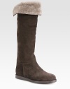 Infused with comfortable shearling lining, this suede knee-high design has grosgrain ribbon trim and a rubber sole. Rubber heel, 1 (25mm)Shaft, 18Leg circumference, 14Suede and grosgrain ribbon upperPull-on styleShearling liningRubber solePadded insoleMade in Italy