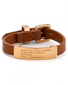 Inspired by surplus style, this MARC BY MARC JACOBS bracelet flaunts a commanding mix of leather and brass. Slip it on to flash your fashion credentials.