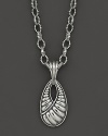 Beautifully sculpted sterling silver makes a bold statement in this pendant necklace