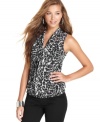 Fierce to the max! This animal-print bow blouse from BCX makes for a stylish companion to your skinny jeans.