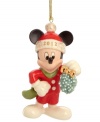 Mickey Mouse keeps a watchful eye for Minnie in this too-cute Christmas ornament featuring the iconic Disney character with a bouquet of mistletoe.