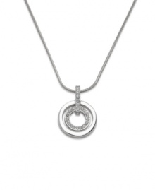 These chic circles provide the perfect element of style and sparkle to your look. Swarovski pendant features two cut-out circles. Crafted in silver tone mixed metal with glittering crystal accents. Approximate length: 16-1/2 inches. Approximate drop: 1 inch.