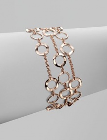 A beautifully crafted chain link punctuated with slim hammered circle links for a thoroughly modern look. 18k gold and sterling silver with 18k rose goldplatingLength, about 7½Fold-over clasp closureImported 