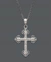 No ordinary way to express your faith, this exquisite style features intricate scrolls of sterling silver that shine with the addition of sparkling diamond accents. Approximate length: 18 inches. Approximate drop: 2-1/4 inches.