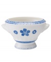 Vintage charm meets modern durability in this footed Farmhouse Touch bowl, featuring cornflower-blue laurels and blooms in premium porcelain from Villeroy & Boch.