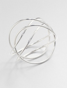 From the Alliance Collection. A sleek tube of sterling silver crisscrosses the wrist in this alluringly simple design by Allan Scharff.Sterling silverDiameter, about 3Width, about 3Imported