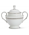 Metropolitan sensibility and modern design combine in this understated white bone china sugar bowl from Lenox's collection of dinnerware and dishes. Platinum gild along the edge is enhanced by a clean, platinum geometric pattern reminiscent of architectural accents. Qualifies for Rebate