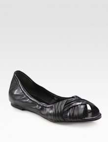 Ruched leather flat with a stretchy upper and unique peep toe. Leather upperLeather liningRubber solePadded insoleImportedOUR FIT MODEL RECOMMENDS ordering one half size down as this style runs large. 