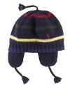 Knit in a colorful striped design, a charming vintage-inspired earflap hat is warm and cozy in classic style.