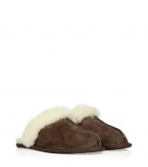 Cozy espresso slippers from Ugg Australia - These luxe slippers feature supple dark brown suede and a comfy lambs wool lining - Stylish seaming down the front with Ugg logo - Stay warm and stylish in these lovely slip-ons