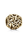 PANDORA's 14K gold charm with cutout hearts and delicate beading complements any collection.