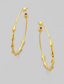 From the Spring Collection. Beautiful raindrops of 24k yellow gold trickle down in hoop shape and end with single ruby stones. 24k yellow gold Ruby Diameter, about 2 Post back Imported 