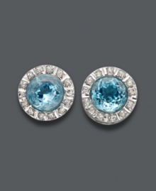 A stunning style in a pale blue hue. Round-cut blue topaz gemstones (6 ct. t.w.) shine amidst circles of sparkling diamond accents. Post setting crafted in 14k white gold. Approximate diameter: 6/16 inch.