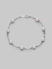 From the Akoya Collection. A delicate chain, sprinkled with lustrous white cultured Akoya pearls. 5mm white, round cultured pearls Quality: A+ 18k white gold Length, about 7 Spring ring clasp Imported