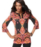 Bugle beads add shine to a richly-colored, printed tunic from INC. The flattering, wrinkle-resistant jersey fabric makes this a great choice for everyday wear.