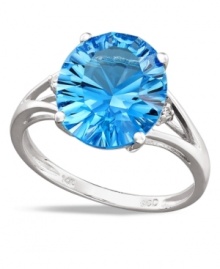 Polish your look in cool blue hues. This vibrant ring features an oval-cut blue topaz (5 ct. t.w.) and sparkling diamond side accents. Crafted in 14k white gold.