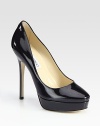 Classic patent leather silhouette with a platform. Self-covered heel, 5 (125mm)Covered platform, 1 (25mm)Compares to a 4 heel (100mm)Patent leather upperLeather liningBuffed leather solePadded insoleMade in ItalyOUR FIT MODEL RECOMMENDS ordering one half size up as this style runs small. 