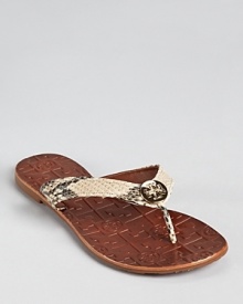 Tory Burch dresses up the flip flop in python printed leather.