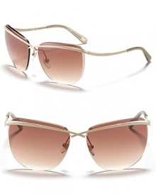 Rimless sunglasses with crossover bar detail and curved arms, a ultra chic style from DIANE von FURSTENBERG.