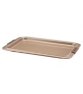 A cookie sheet that knows when to let go, this piece of bakeware is an essential for hassle-free cooking with a strong carbon steel core coated in a durable bronze nonstick finish that provides quick and effortless food release and fast cleaning. Designed with wide rimming along the edge, this cookie sheet is easy to maneuver and handle even with bulky oven mitts. Limited lifetime warranty.