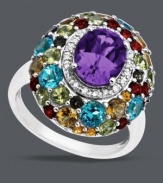 Spice up your accessory collection with Town & Country's bold cluster ring. Set in sterling silver, this oval-shaped statement ring includes amethyst (1-5/8 ct. t.w.), blue topaz (1/5 ct. t.w.), and citrine (1/8 ct. t.w.), with rhodolite garnet, smokey quartz, and peridot accents. Size 7.