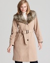 This Calvin Klein trench coat gets a glamorous update with a faux fur neckline--a luxe twist on the perennial favorite.