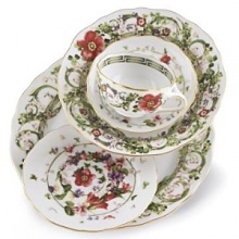 Flower Fantasy espresso cup by Versace by Rosenthal. Derived from one of the fashion houses archival prints, this exuberant collection evokes the romance and promise of spring as hand-painted renderings of meadow herbs, sweet-scented flowers and even four-leaf clovers intermingle in a subtle yet lively design.