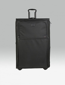 This wheeled packing case has enough room for weeks of essentials or to carry home travel acquisitions. Main compartment with pop-up expansion Two exterior zip accessories pockets Two inside zip accessories pockets Top, side and bottom carry handles Telescoping handle Protective feet Tumi Tracer Protection Ballistic nylon Imported 21W X 32H X 11D (13D expanded)