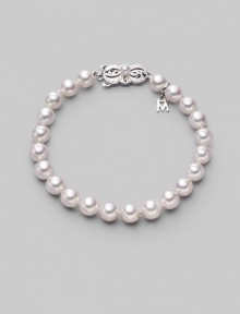 From the Akoya Collection. A simple strand of lustrous white cultured Akoya pearls with a signature filigree clasp. 7mm white, round cultured pearls Quality: A1 18k white gold Length, about 7 Mikimoto signature clasp Imported