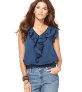 Romantic ruffles adorn the front and sleeves of this top from DKNY Jeans. Rendered from chambray cotton, it's essentially springy.