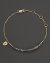 Labradorite sparkles on this delicate yellow gold bracelet from Meira T.