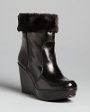 Designer Stuart Weitzman gives these versatile wedge booties a touch of luxe with plush, faux fur linings.