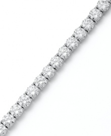 Match point. Arabella's stunning tennis bracelet combines dozens of round-cut Swarovski zirconias (31 ct. t.w.) in polished sterling silver. Approximate length: 7-1/2 inches.