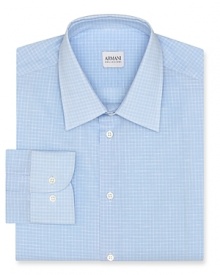 Made from superior cotton and featuring a handsome allover check print, this refined and reserved dress shirt offers the modern man an on-trend slim silhouette for a polished look in and outside the office.