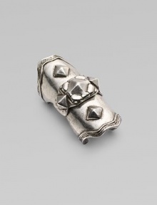 A piece of armor in silverplated metal with pyramid studding for a bold, edgy statement.Silverplated Center hinge Diameter, about 20mm, (.78) Length, about 2 Made in USA Additional Information Women's Ring Size Guide 