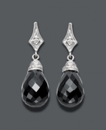 The perfect complement to your little black dress -- these divine drops will create a dramatic effect. Set in 14k white gold, a round-cut diamond (1/3 ct. t.w.) shines against the backdrop of faceted onyx (14 mm x 10 mm). Approximate drop: 1 inch.