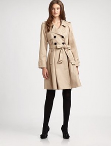 A cotton trenchcoat with feminine details and a waist-defining self-tie belt.Notched collarButton frontSelf-tie beltFully linedAbout 38 from shoulder to hemCottonDry cleanImported Model shown is 5'10 (177cm) wearing US size 4. 