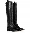 With their clean lines and sleek polished black leather, Kors Michael Kors tall boots as chic as they are versatile - Round toe, metal back zip, top snap, side pull, stitched leather welt, stacked leather heel - Knee height - Wear with everything from knit dresses and carryall totes to leather leggings and oversized cashmere pullovers