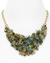 There's nothing quiet about this clustered bib necklace from Aqua with flaunts a chic cluster of multi colored crystals and stones. Turn up the volume.