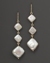 A charming drop earring in 14 Kt. gold with diagonal fresh water pearls.