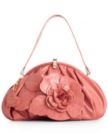 A romantic floral embellishment makes this pretty purse instantly lovable, by Jessica Simpson.