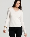 Tweed at the back and neckline of this Theory wool sweater lends timeless style to the v neck silhouette--chic with black pants and golden bangles for your nine to five workday.